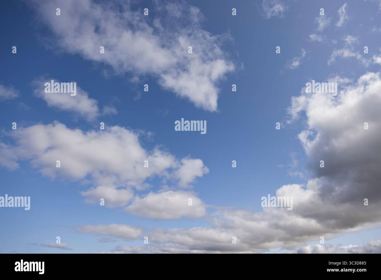 Blue sky with fluffy white clouds Stock Photo