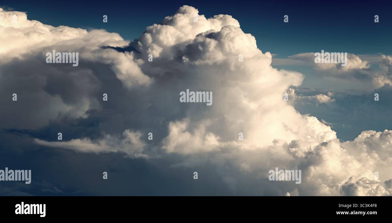 blue sky with a few clouds. The sky is very bright and the clouds are ...