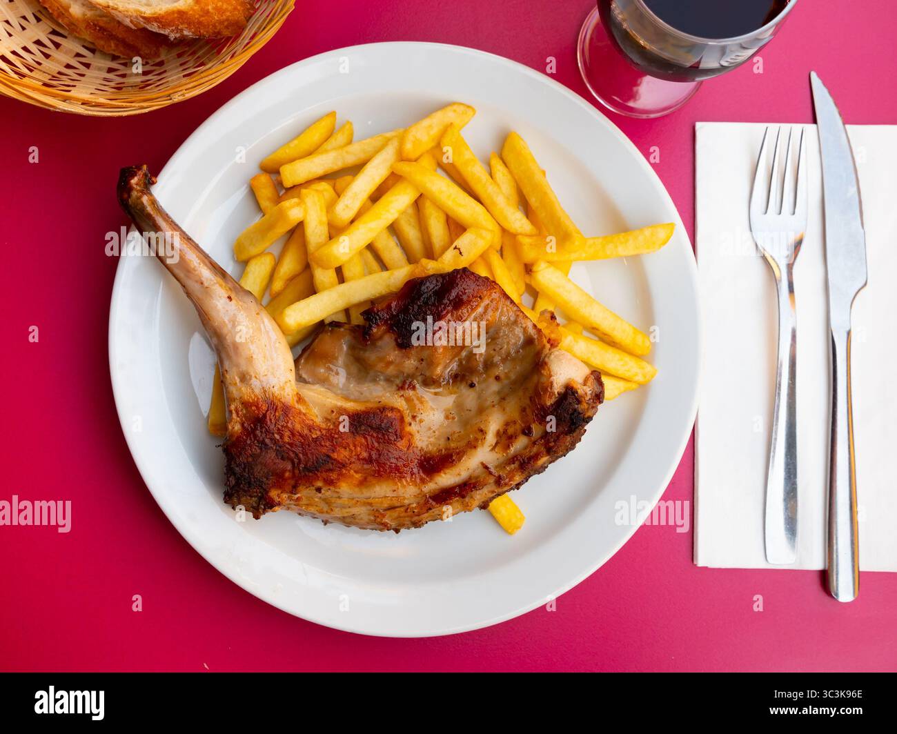 Braised rabbit served with potato garnish Stock Photo