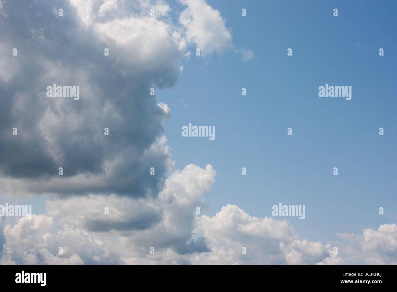 Bright blue sky, white clouds floating in the sky. Stock Photo