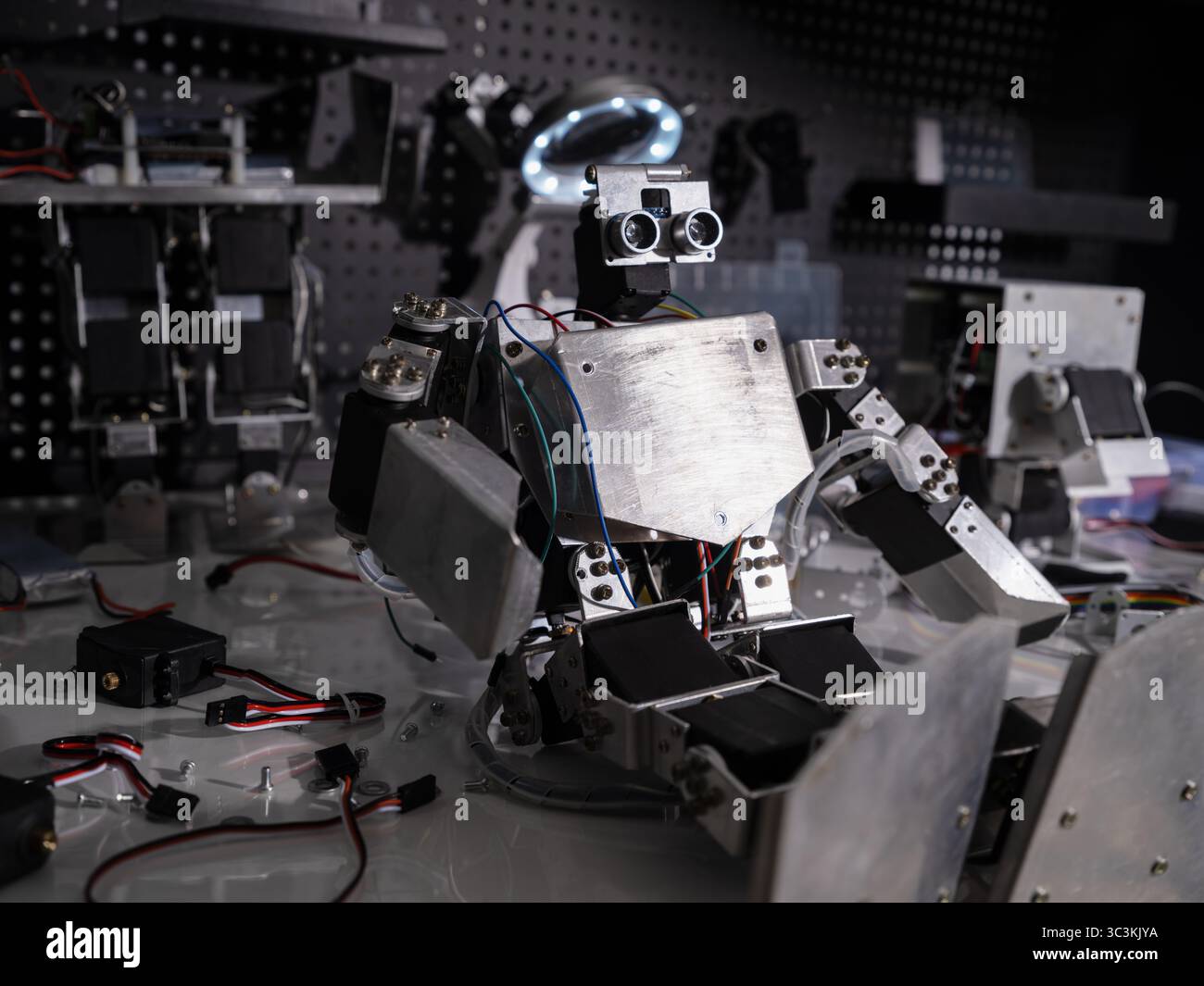 A robot is on the workbench Stock Photo