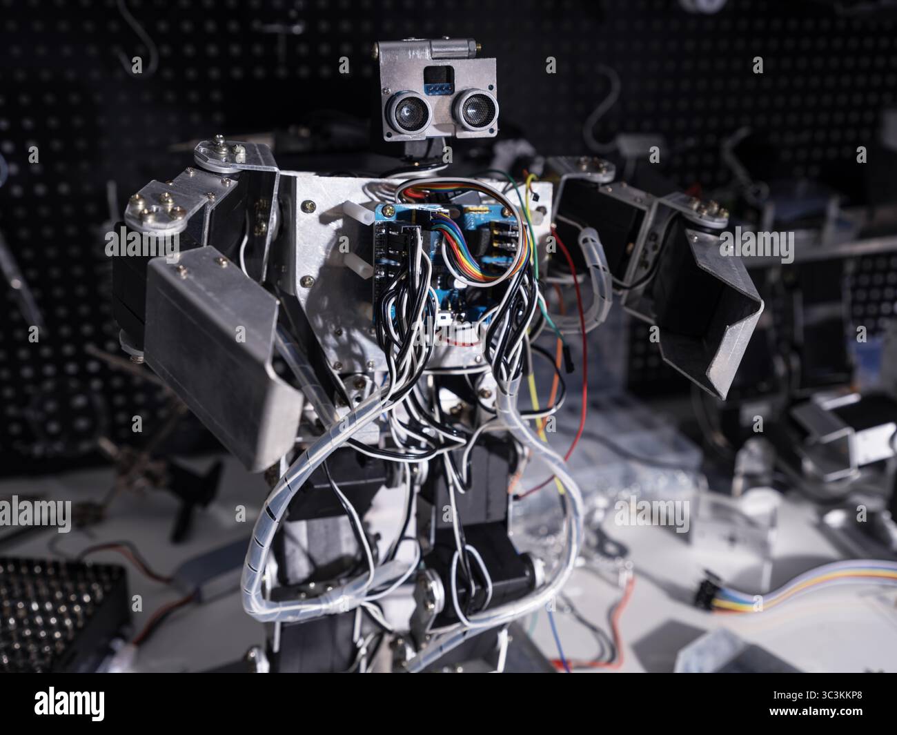 A robot is on the workbench Stock Photo