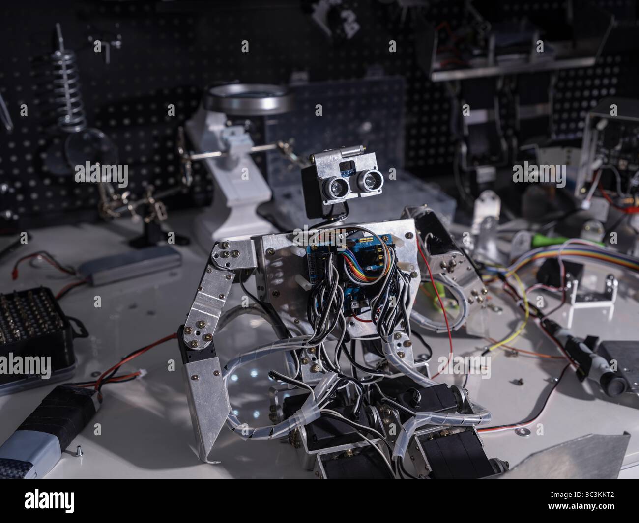 A robot is on the workbench Stock Photo