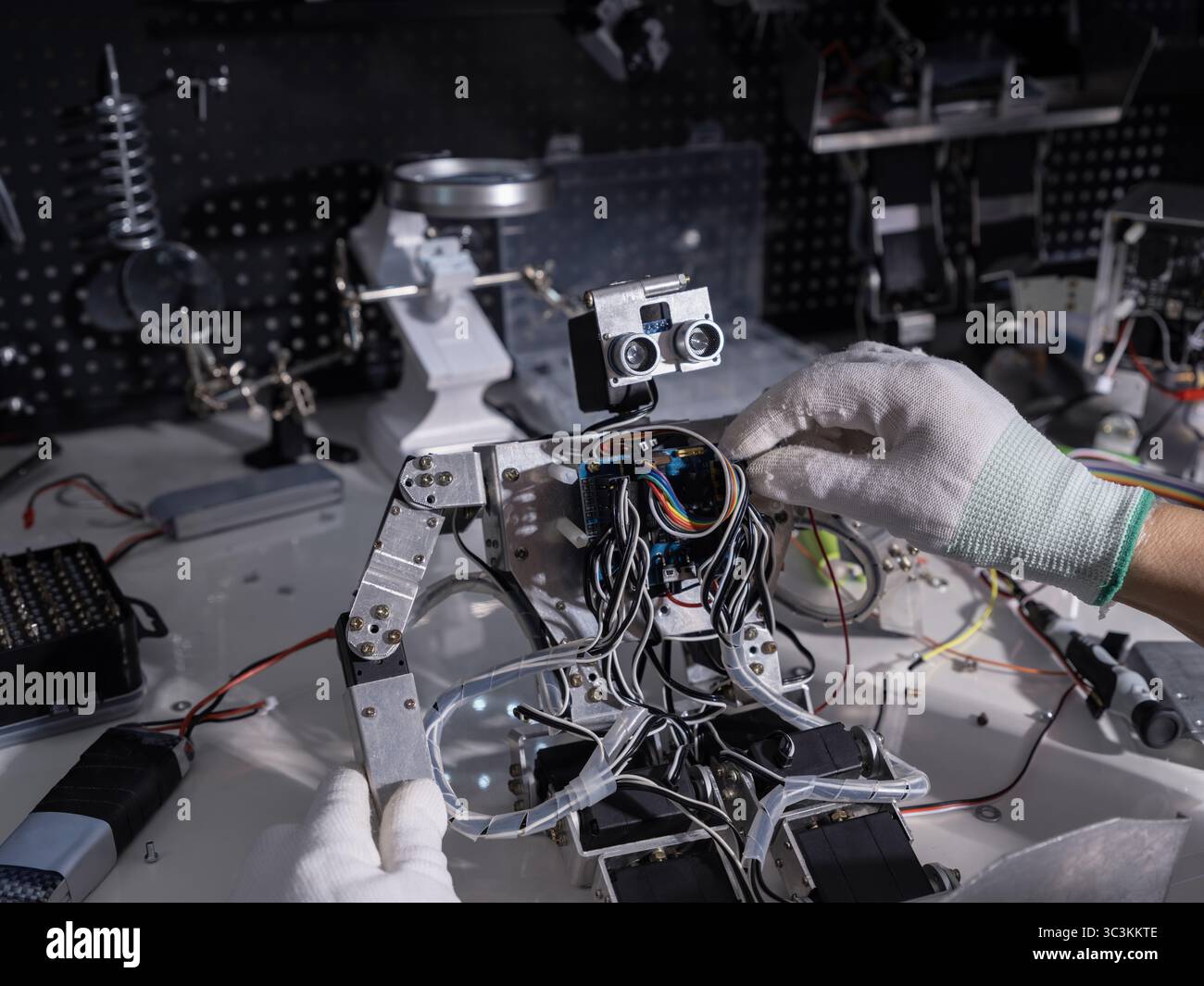 Repair the robot on the workbench Stock Photo