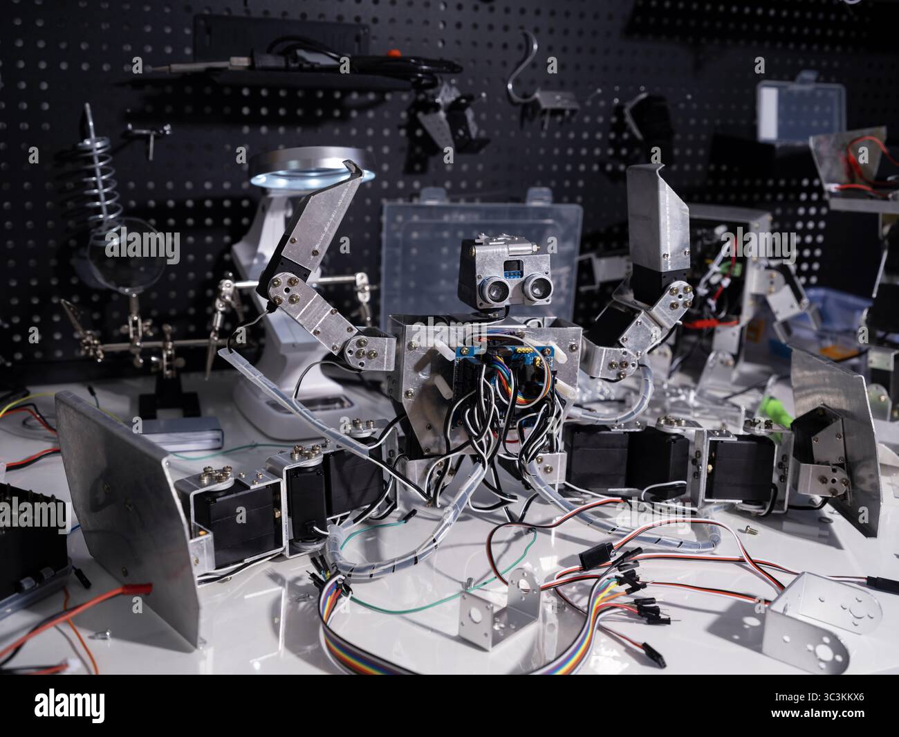 A robot is on the workbench Stock Photo
