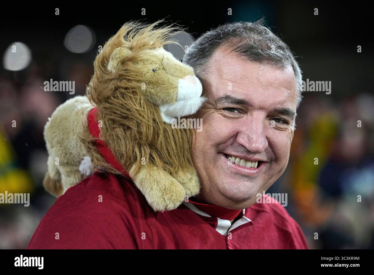 A Lions fan smiles as he waits for the start of the second rugby union ...