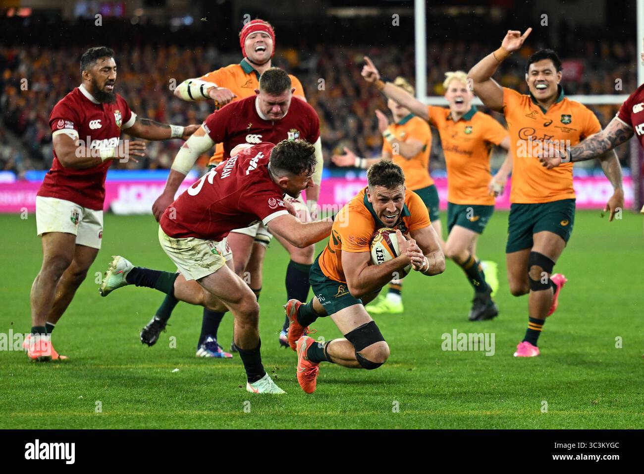Jake Gordon of Australia dives to score a try during the Second Test ...