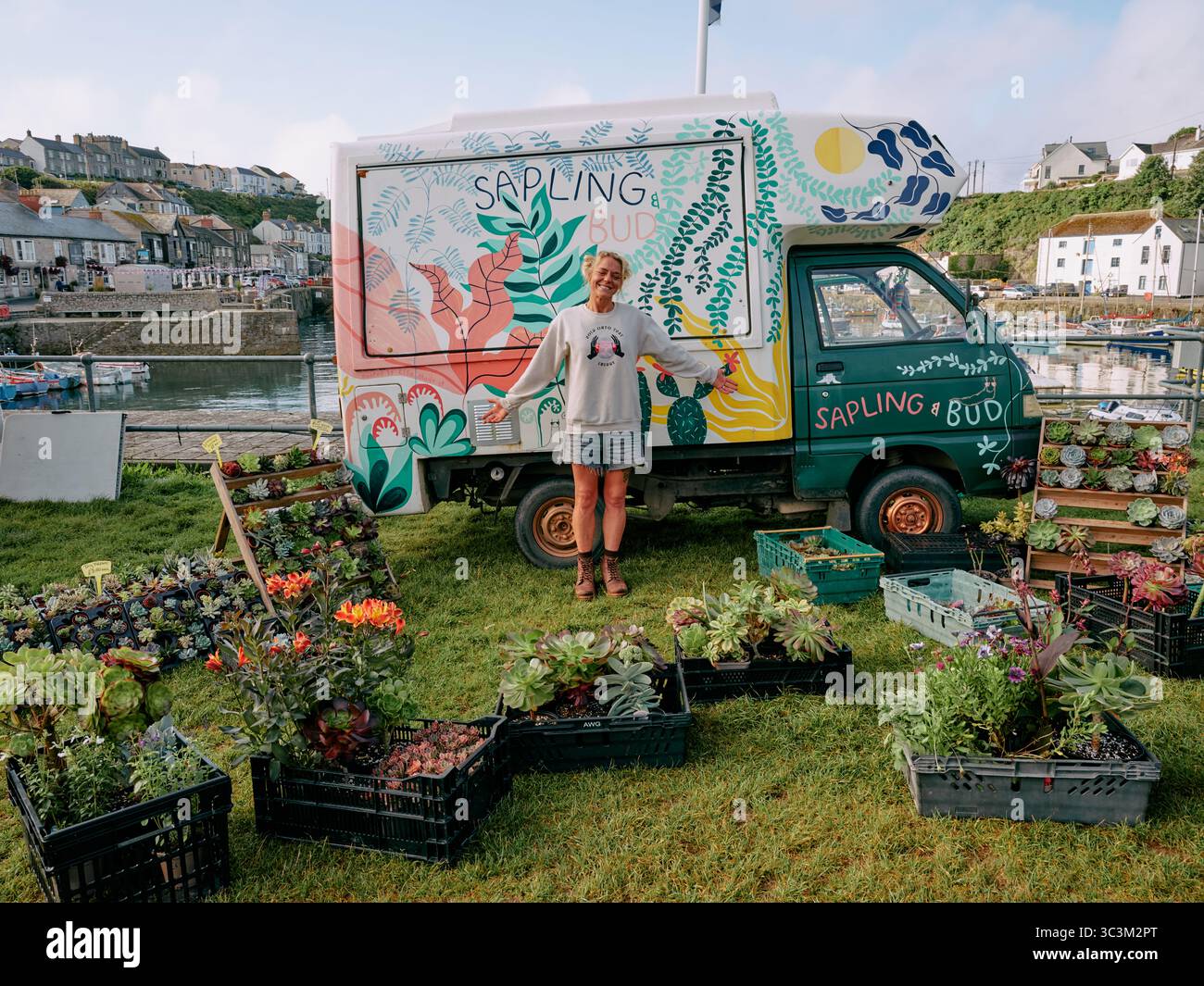 Sapling and Bud  - A mobile garden plant seller self employed start up business selling garden plants from her decorated van in Porthleven, Cornwall . Stock Photo