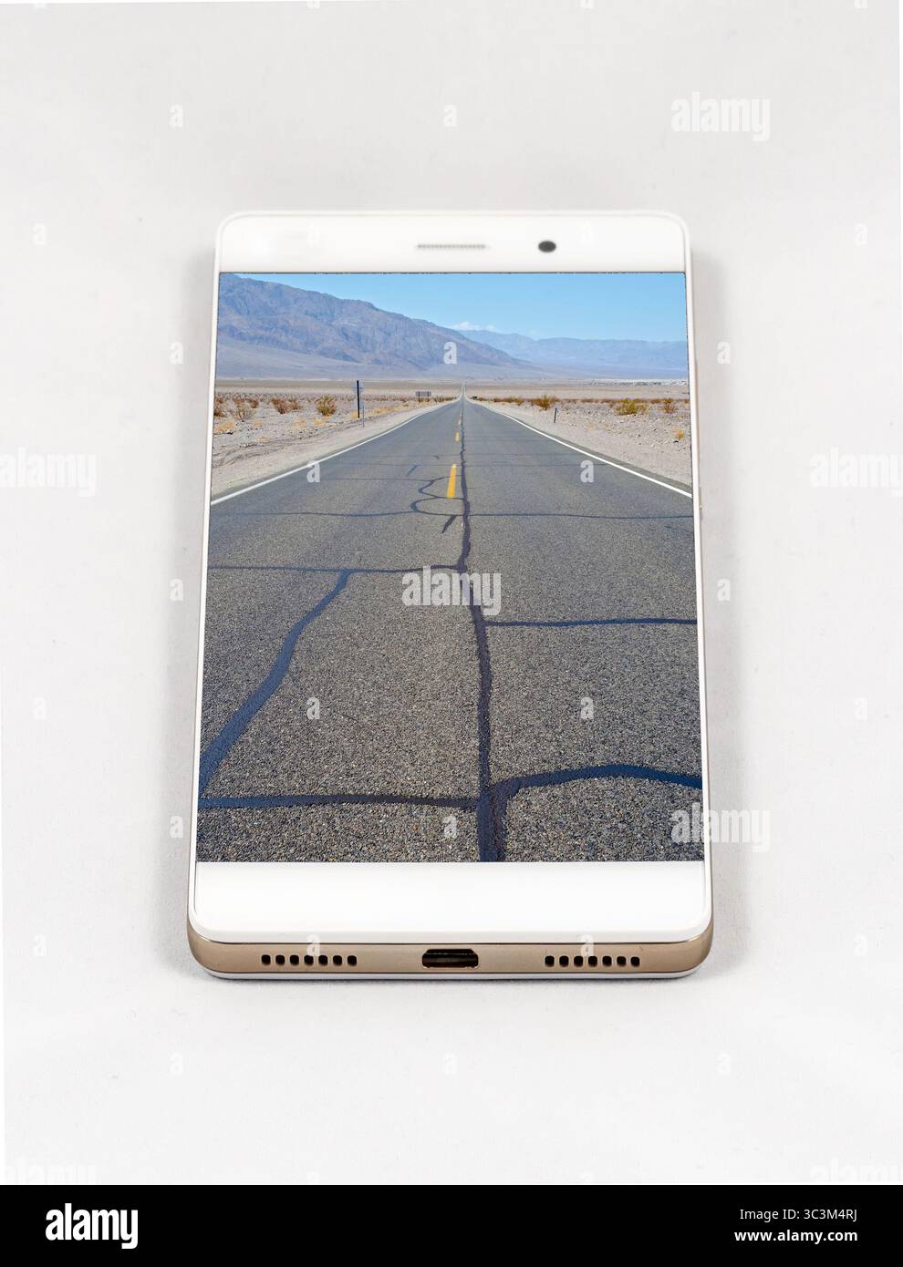 Modern smartphone with full screen picture of Death Valley, USA. Concept for travel smartphone photography. All images in this composition are made by Stock Photo