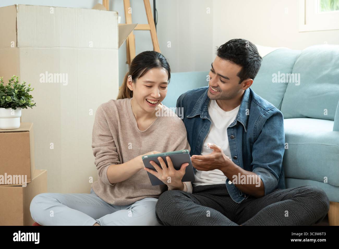 Moving house, relocation. Couple choose design for building new ...