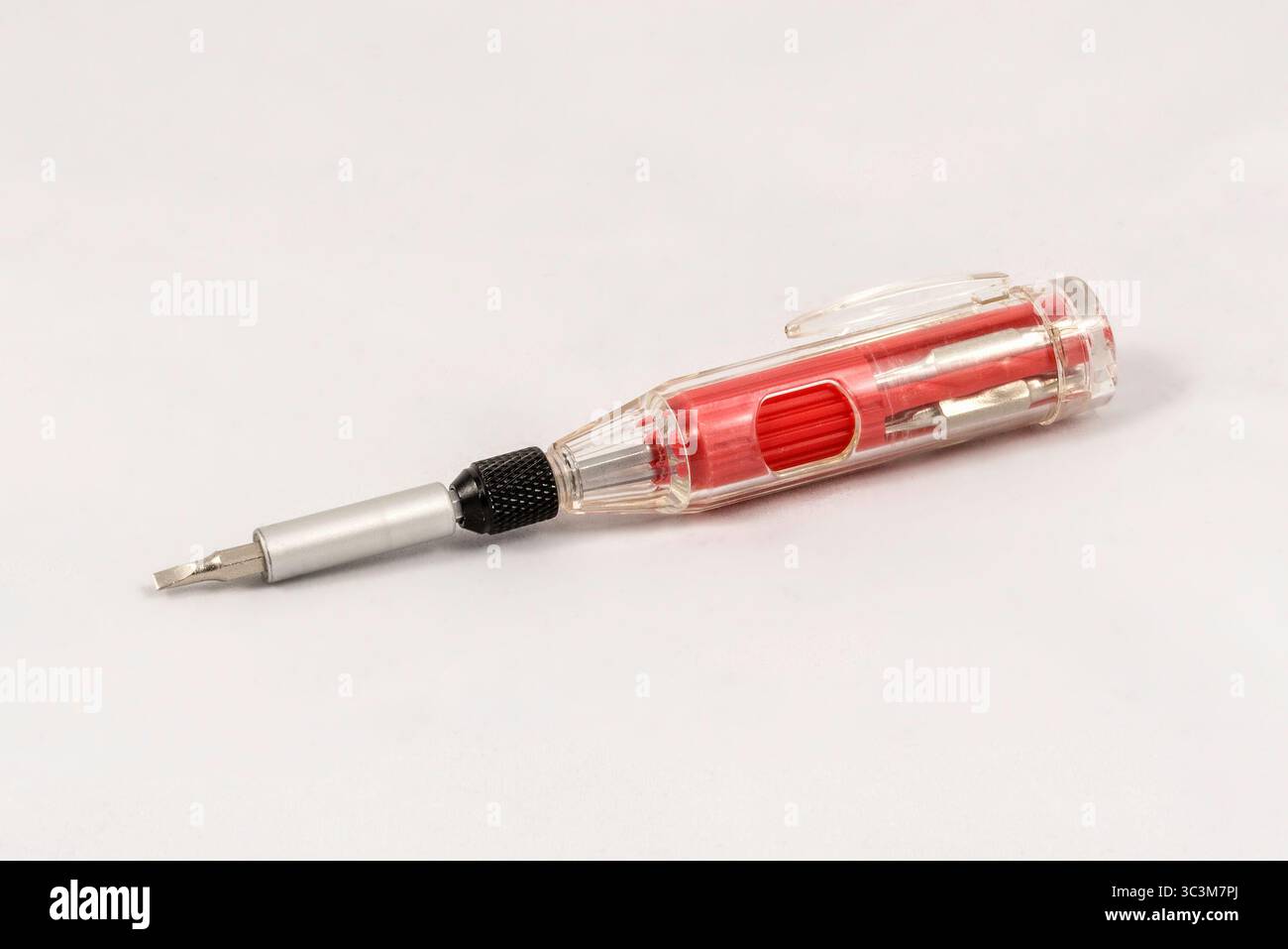 Multi-bit red mini screwdriver, isolated on white background Stock Photo