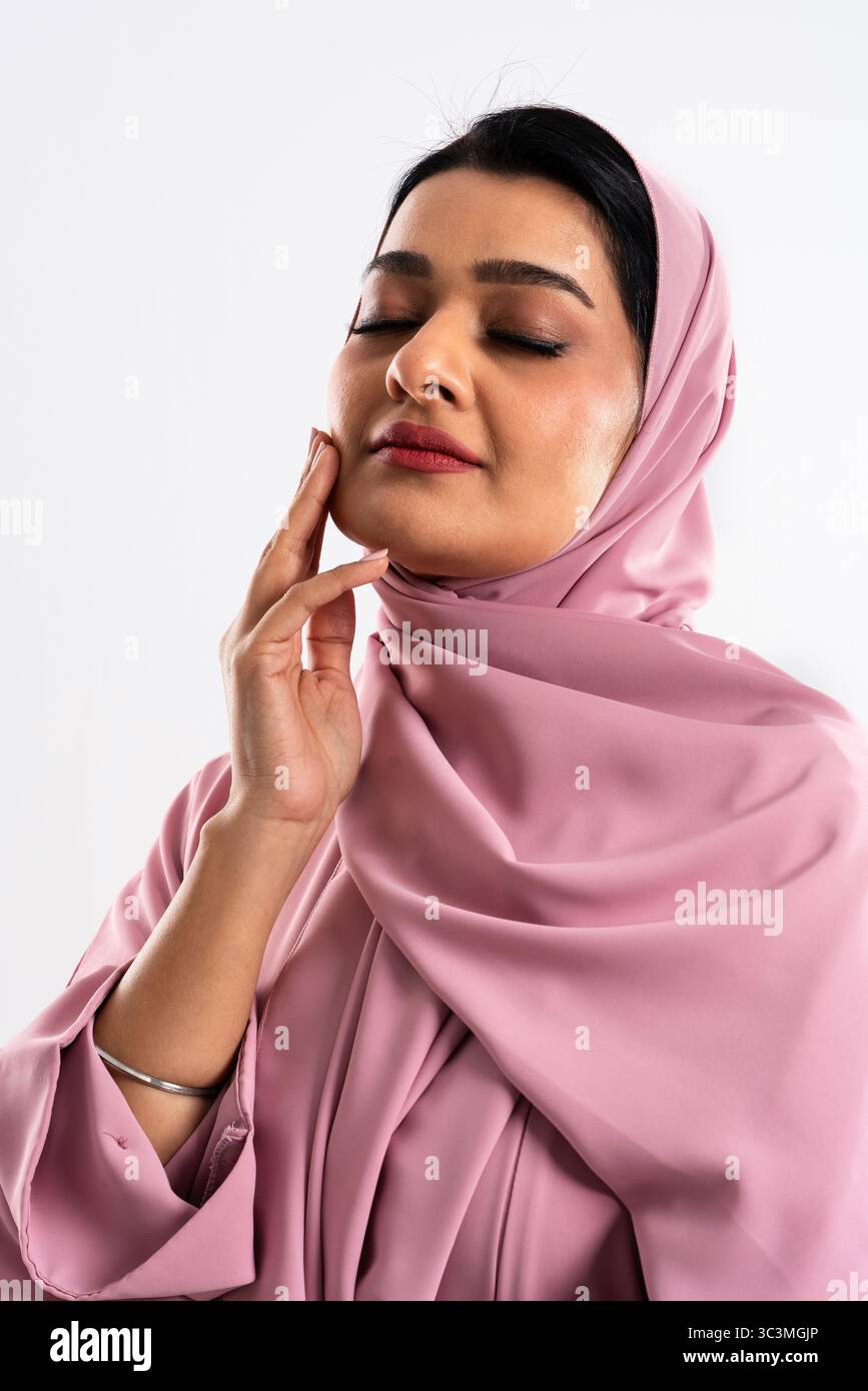 Young woman wearing pink hijab hi-res stock photography and images - Alamy
