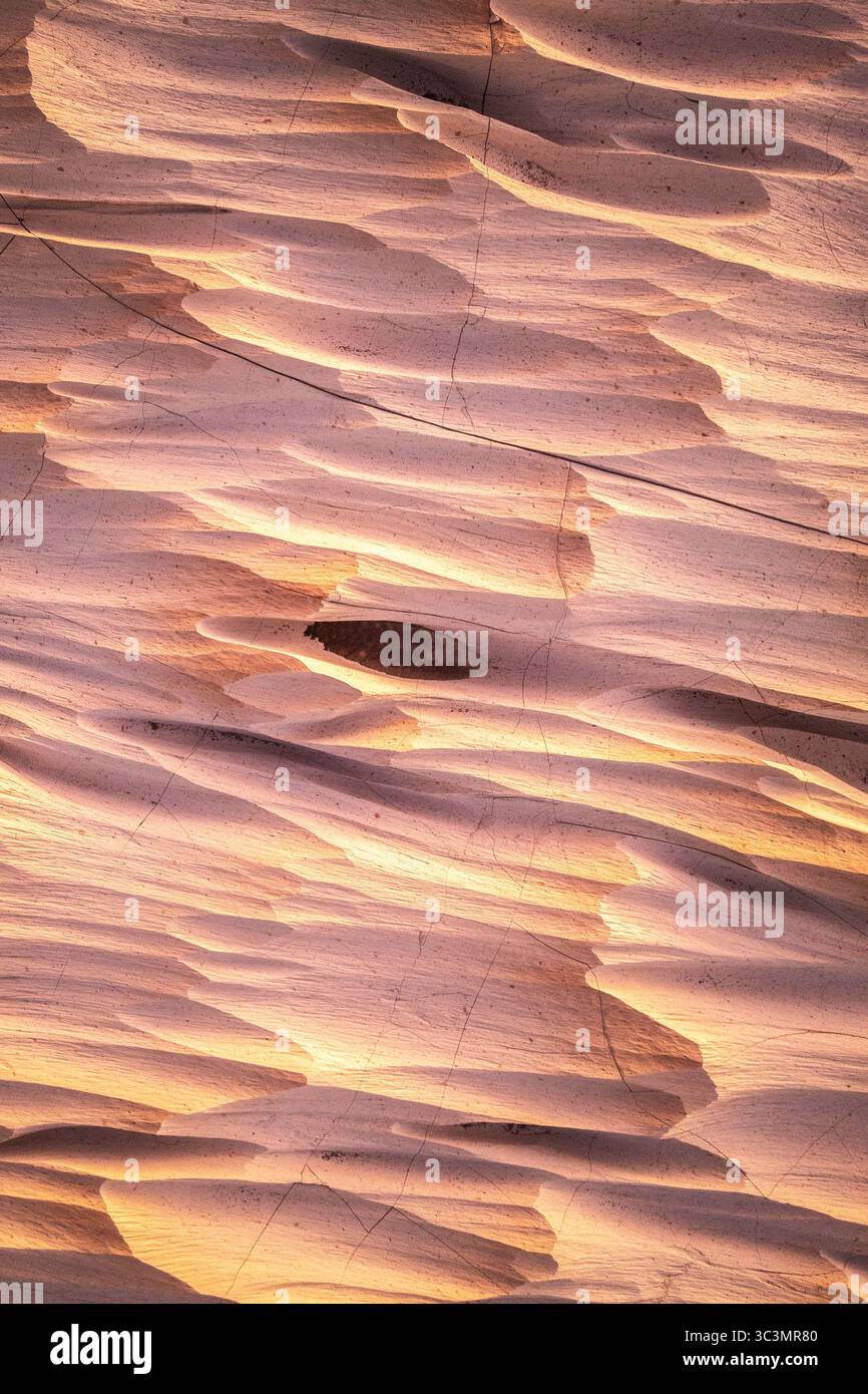 Stunning golden pumice stone formations in Catamarca, Argentina, captured at sunset. The textured surface and warm hues create a breathtaking natural Stock Photo