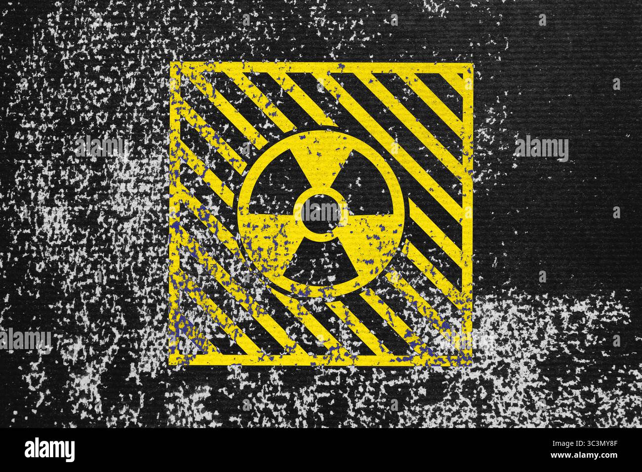 Radioactive sign on black textured surface. Radiological pollution Stock Photo