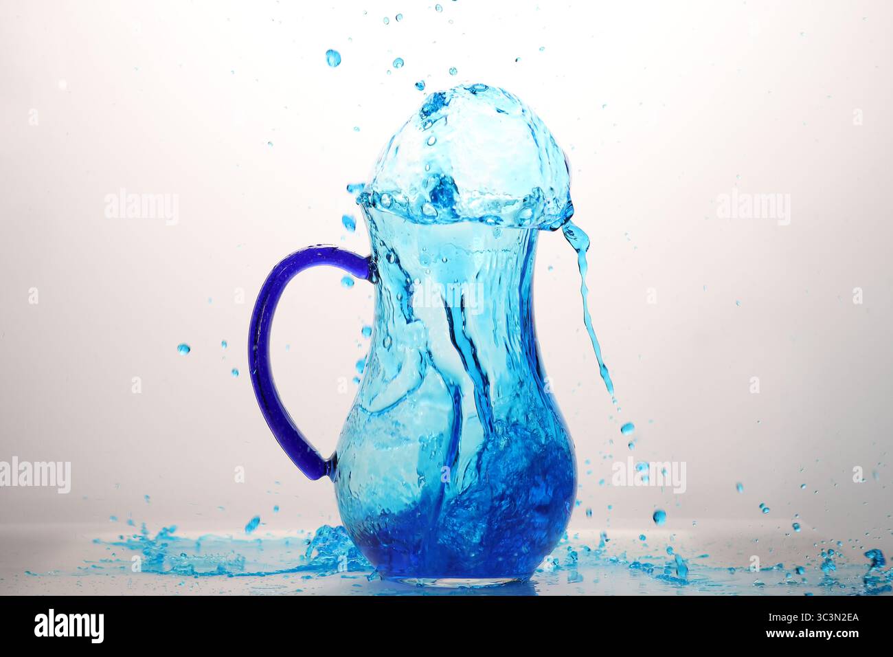blue water explosion in glass jar Stock Photo
