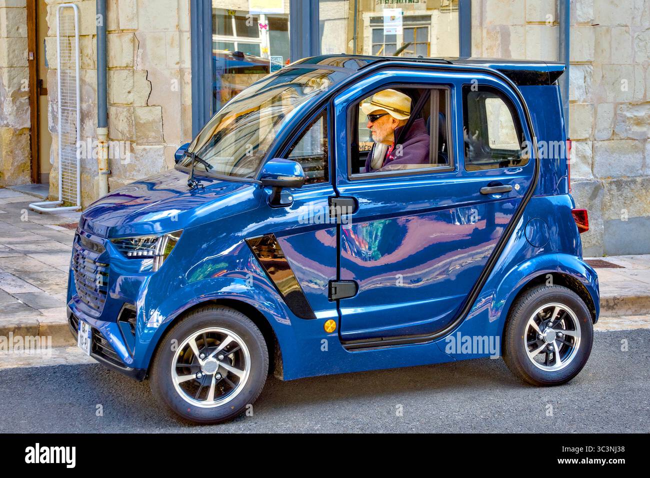 IMF E-Confort electric micro car with 45 kph maximum allowed speed - central France. Stock Photo