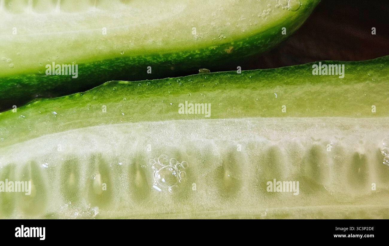 Close-Up of Fresh Cucumber Slices with Water Droplets - Smartphone Captured Stock Image