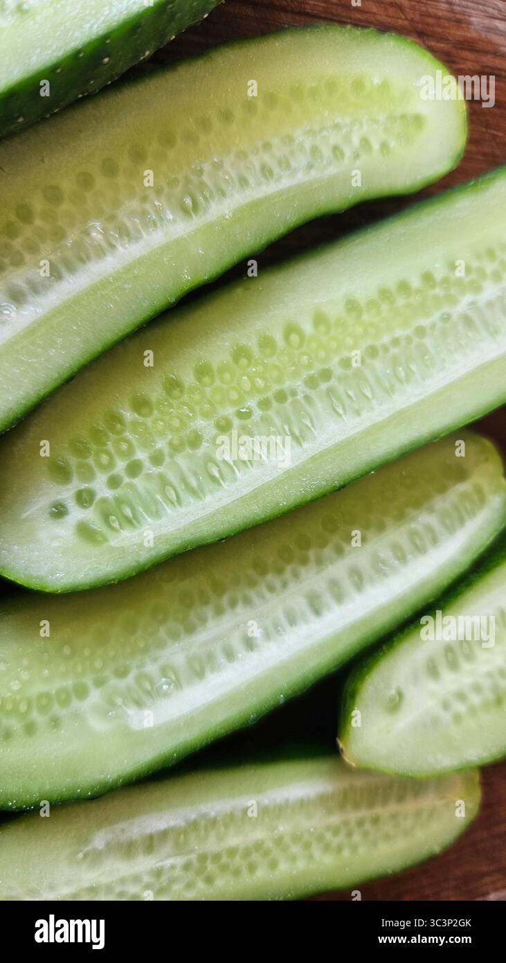 Fresh Cucumber Halves on Wooden Surface – Healthy Food Concept - Smartphone Captured Stock Image