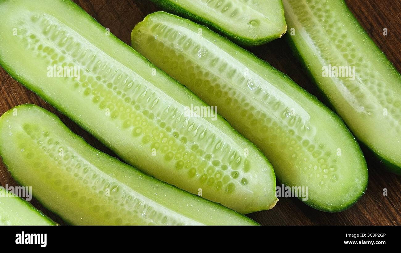 Fresh Cucumber Halves on Wooden Surface – Healthy Food Concept - Smartphone Captured Stock Image