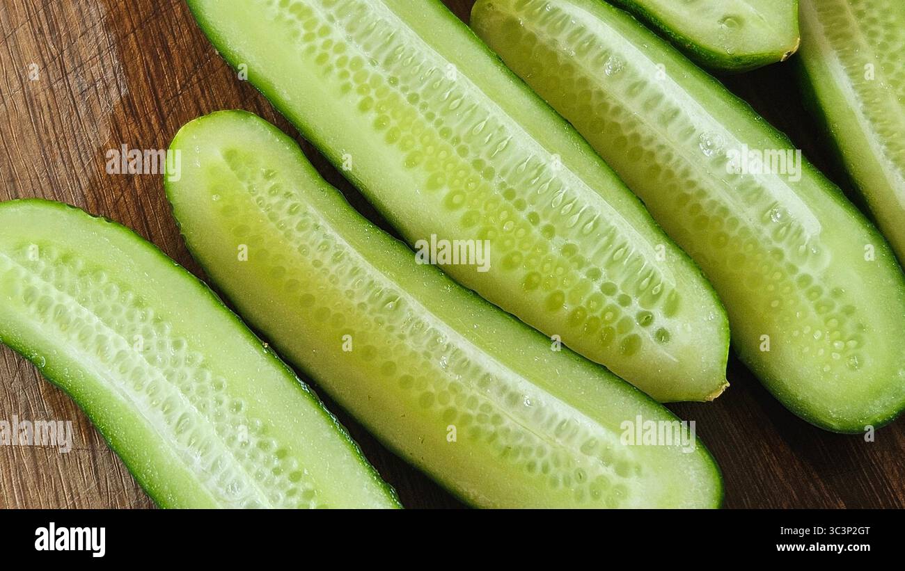 Fresh Cucumber Halves on Wooden Surface – Healthy Food Concept - Smartphone Captured Stock Image
