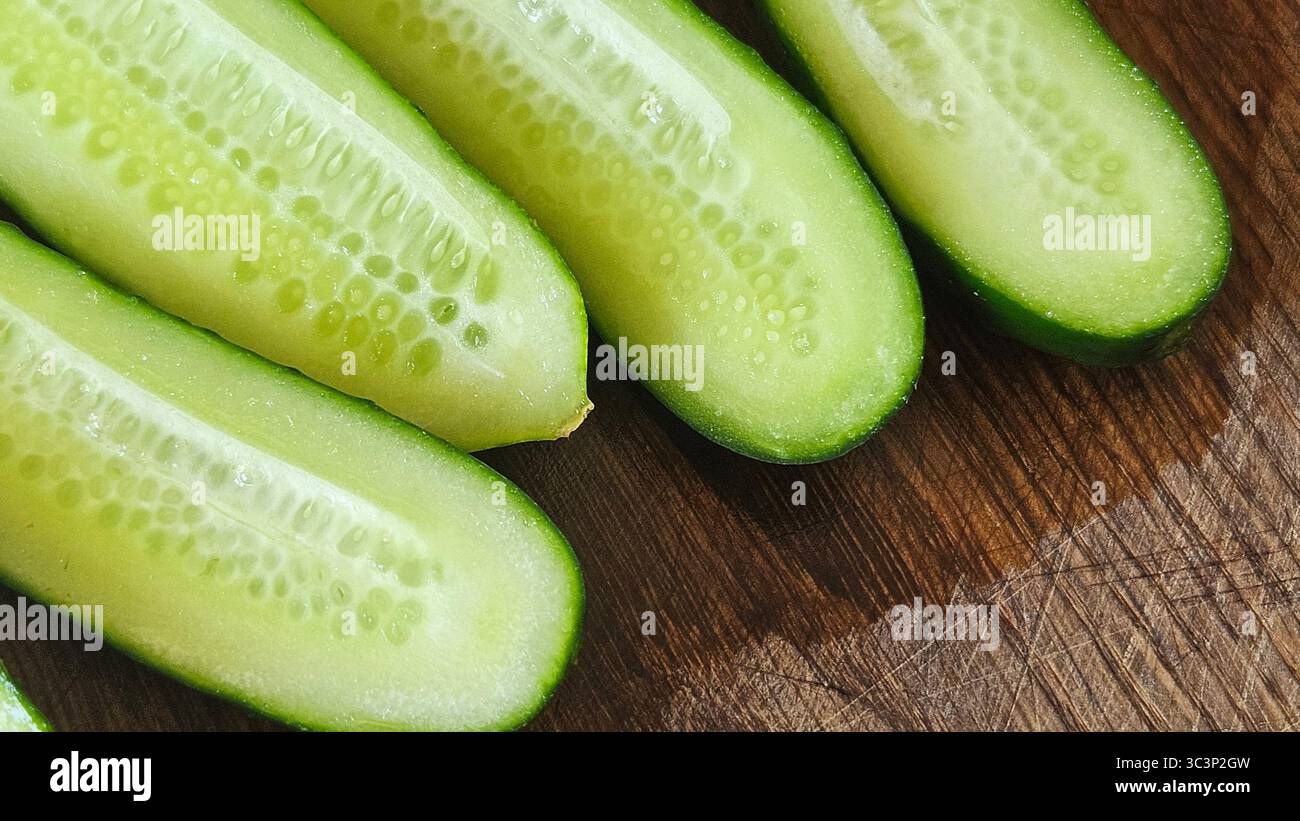 Fresh Cucumber Halves on Wooden Surface – Healthy Food Concept - Smartphone Captured Stock Image