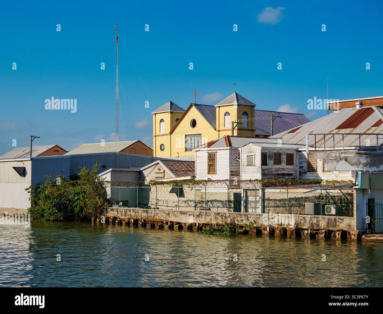 View over Collet Canal towards the Holy Redeemer Cathedral, Belize City, Belize District, Belize Stock Photo