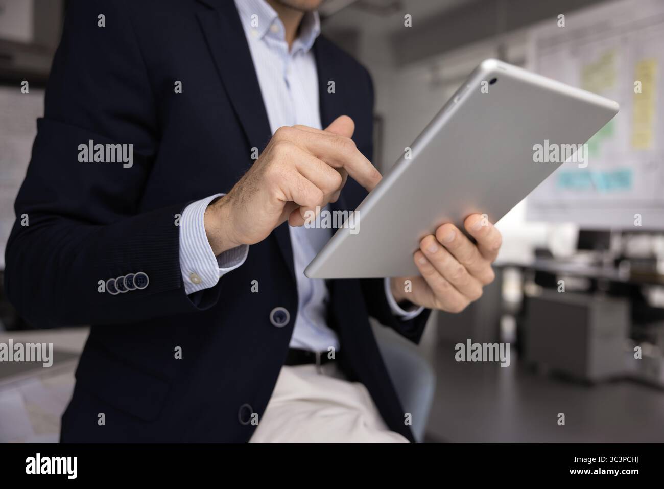 Business man using tablet in modern office Stock Photo