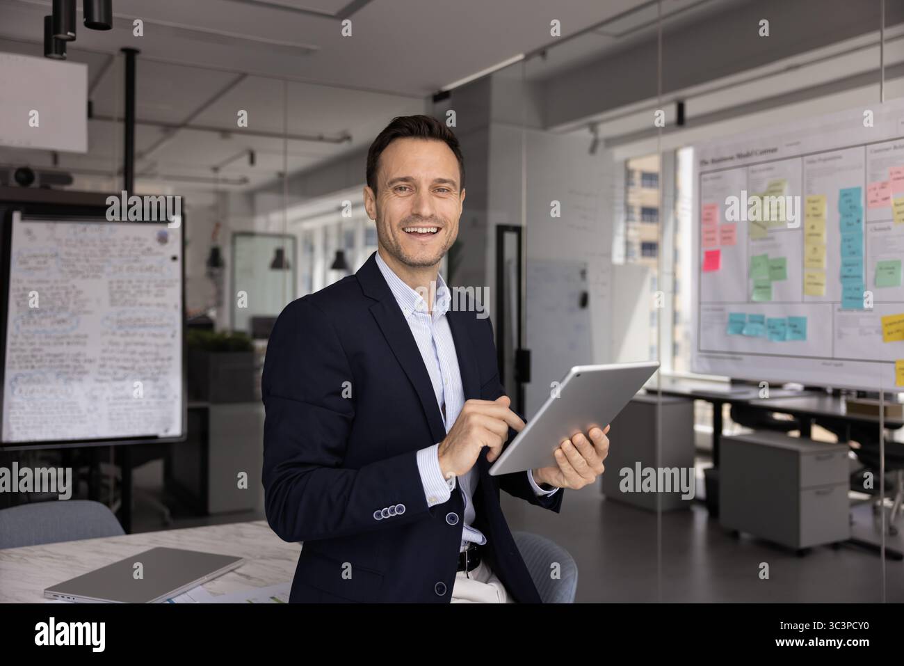 Businessman enjoy workflow, using innovative business technologies, portrait Stock Photo