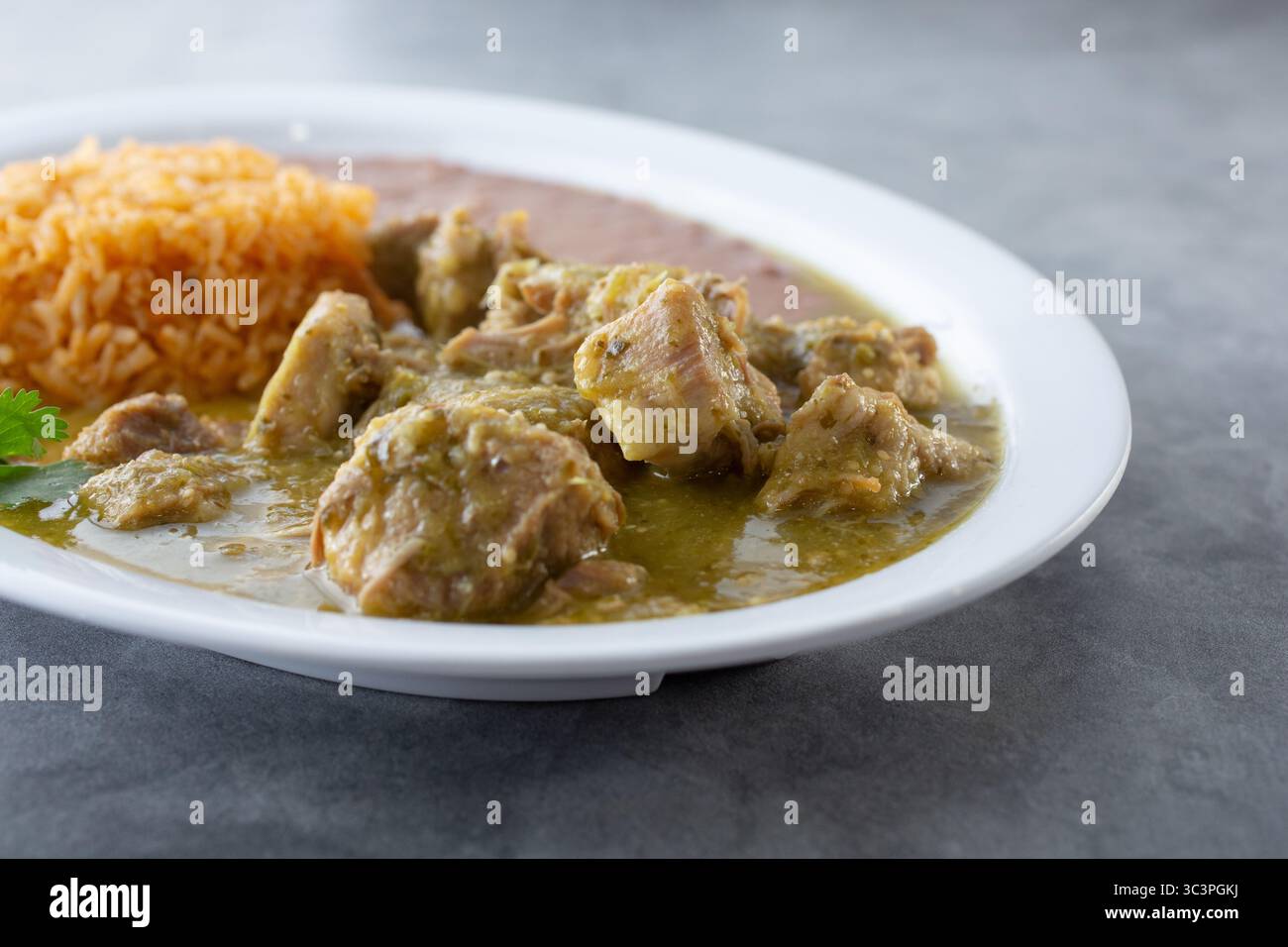 A view of a plate of pork chile verde. Stock Photo