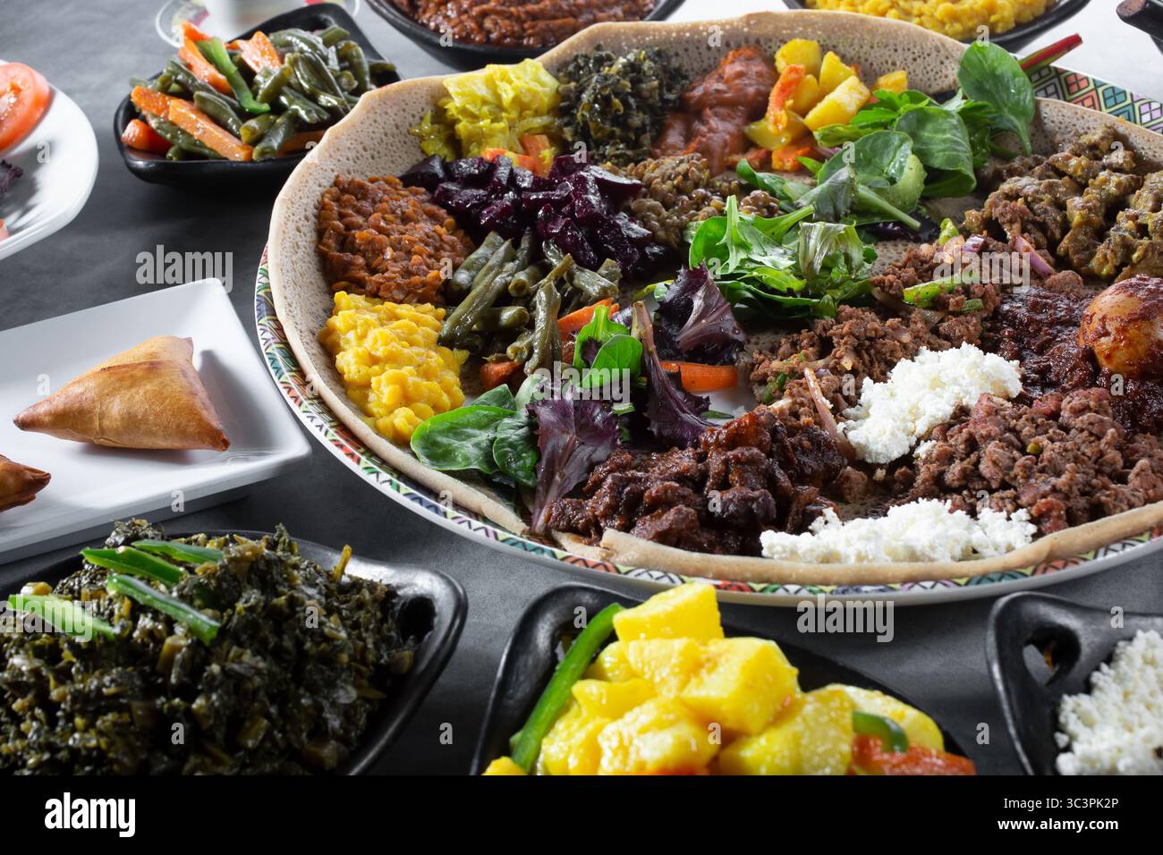A view of assorted Ethiopian entrees, featuring a combination platter ...