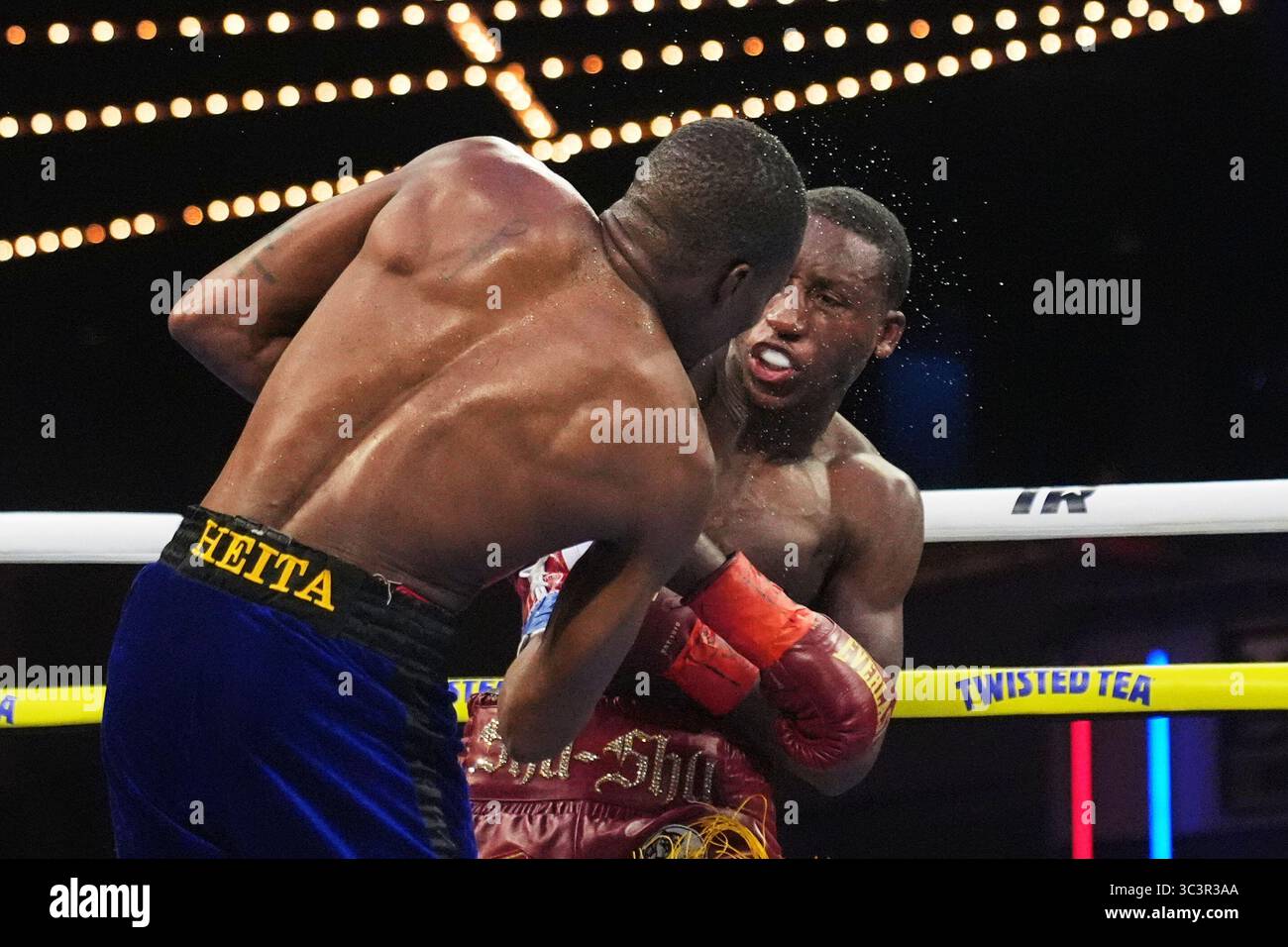 Namibia Boxing Bruce Carrington, right, punches Namibia's Mateus Heita during the ...