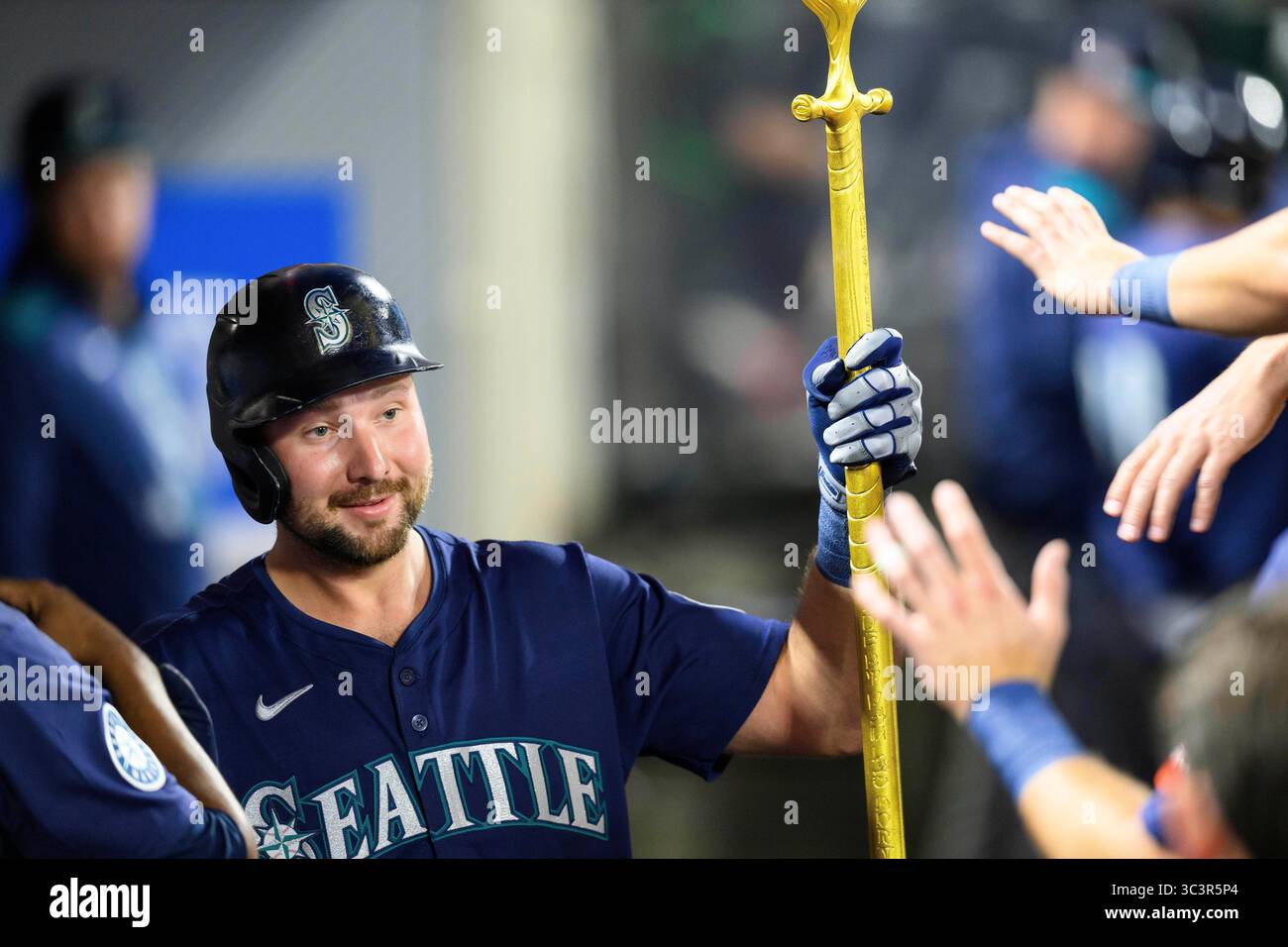 Seattle Mariners' Cal Raleigh is greeted by teammates after hitting a ...