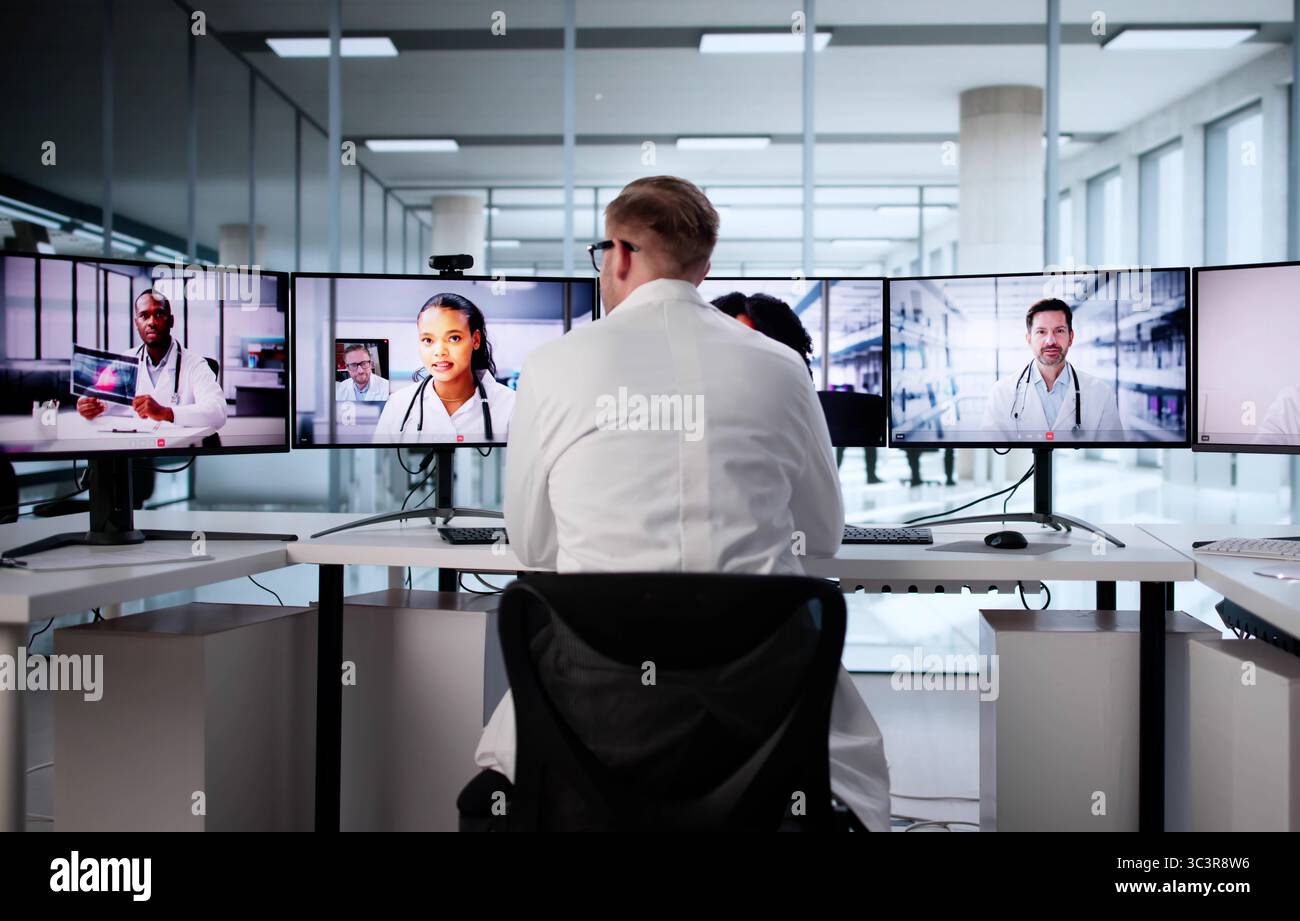 Virtual Job Interview With Young Man In Office Using Computer Stock Photo