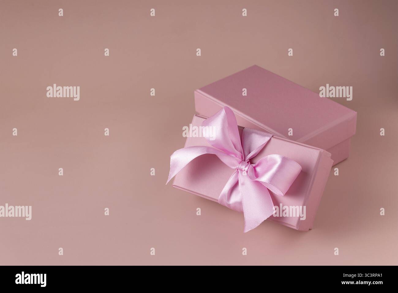 Pink gift boxes on beige background Stock Photo