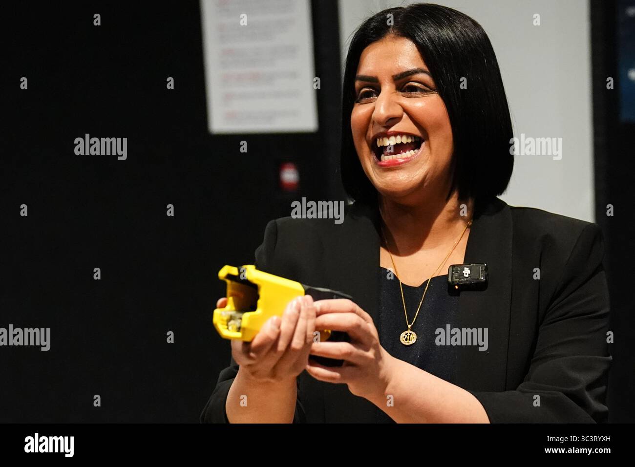 EMBARGOED TO 0001 MONDAY JULY 28 Lord Chancellor and Justice Secretary Shabana Mahmood holds a taser during the launch of a taser trial in the adult male prison estate at the Operational Response & Resilience Unit (ORRU) training site in Kidlington, Oxfordshire. Picture date: Thursday July 24, 2025. Stock Photo