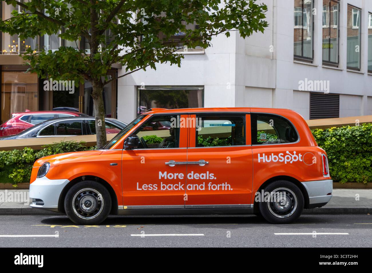 A HubSpot advertisement on a classic taxi in London, United Kingdom Stock Photo