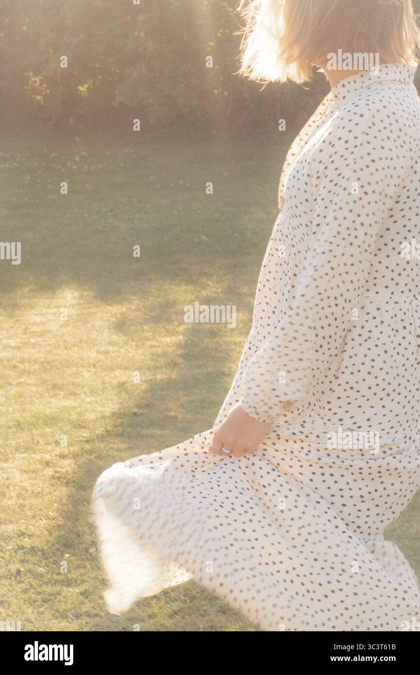 Wearing white polka dot hi-res stock photography and images - Alamy