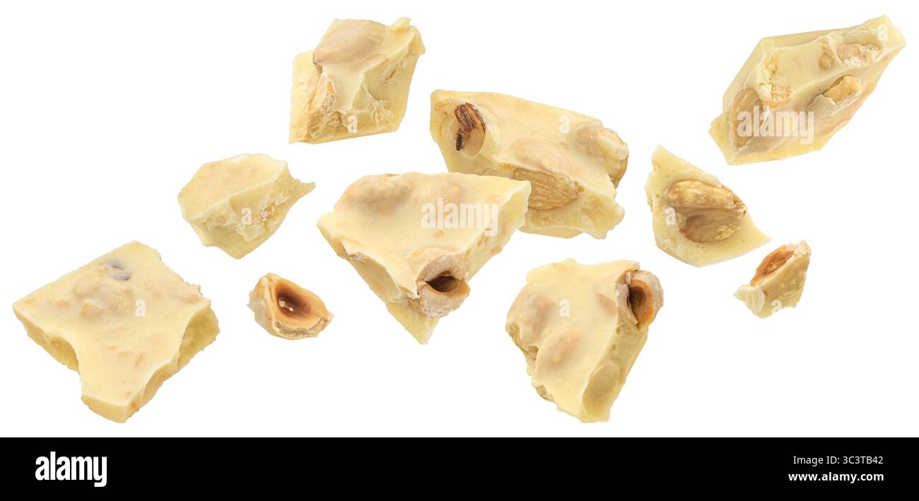 Broken white chocolate bar with hazelnut isolated on white background Stock Photo