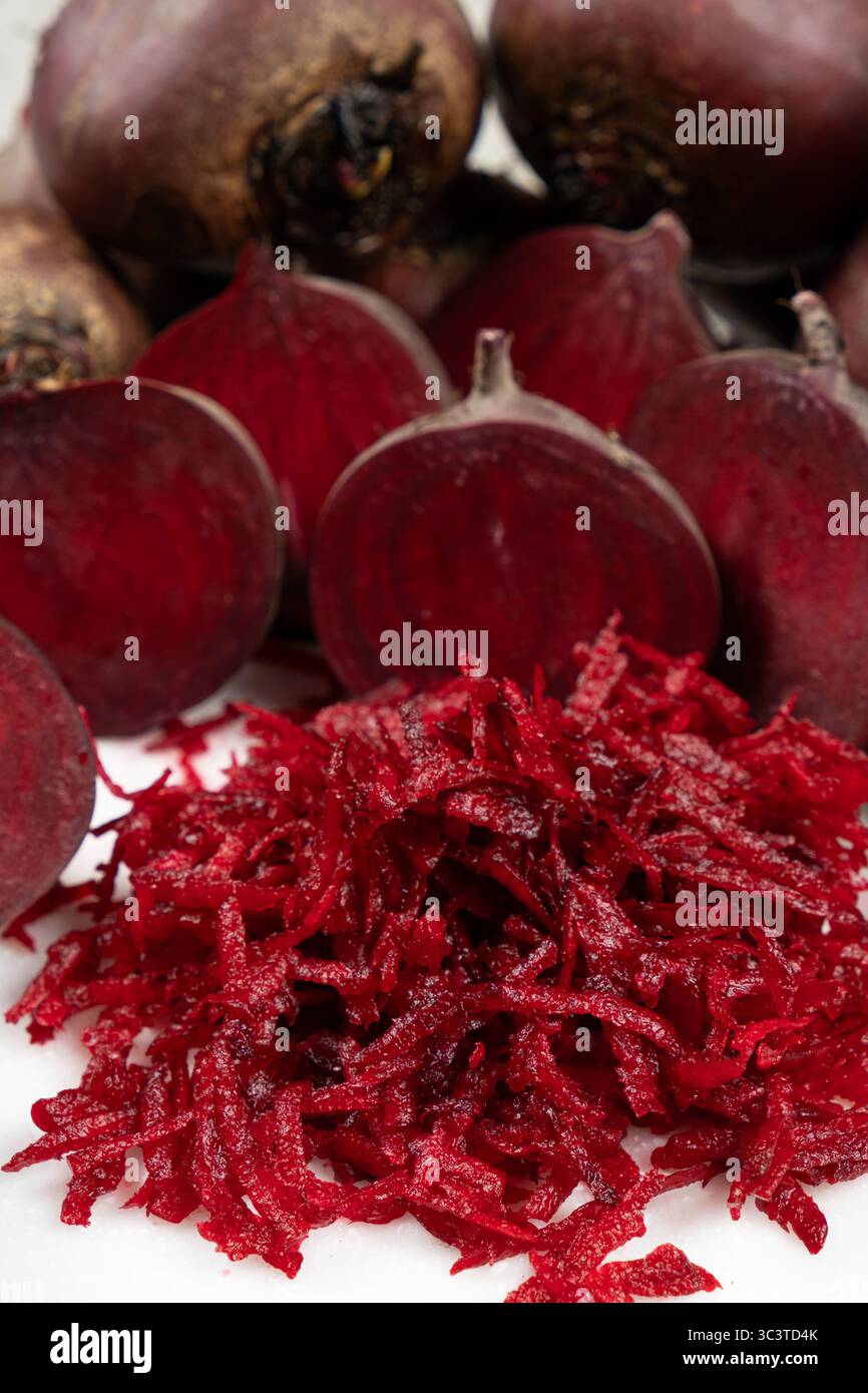 Fresh raw red beetroot grated, beet recipes. Stock Photo
