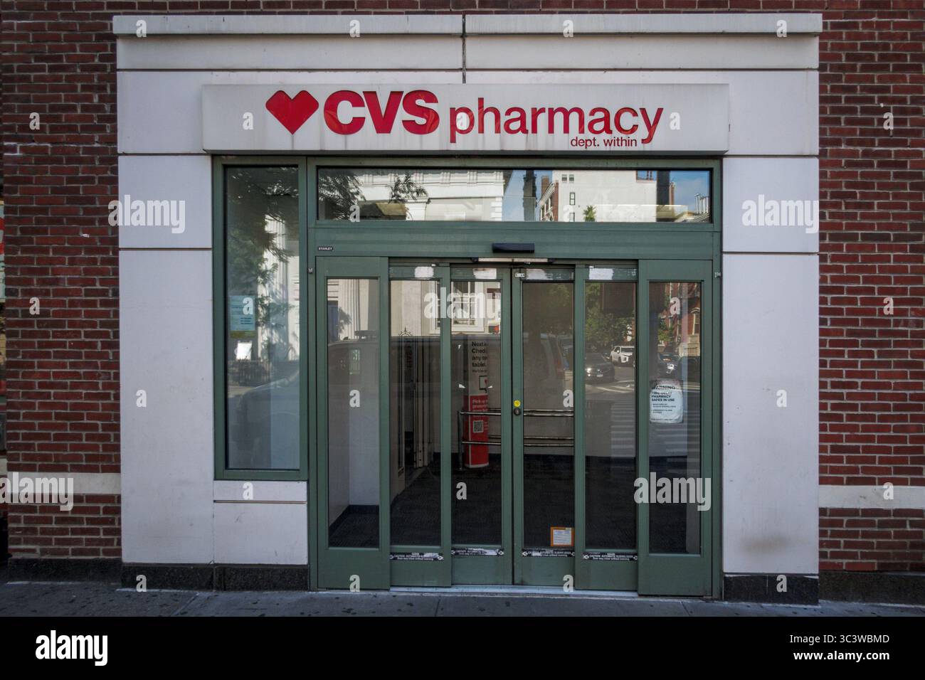 Sign at the entrance to a CVS Pharmacy in Manhattan. (Photo by Erik ...