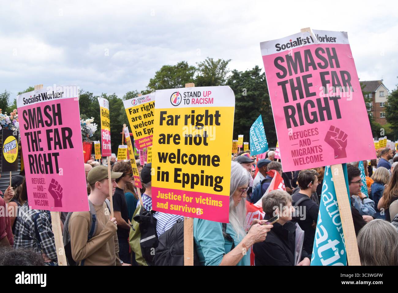 Epping, UK. 27th July 2025. Protesters gather outside Epping Station ahead of the march in support of migrants. Several anti-migrant protests targeting the Bell Hotel, where migrants are housed, have taken place after an asylum seeker was charged with allegedly trying to kiss a 14-year-old girl. Credit: Vuk Valcic/Alamy Live News Stock Photo