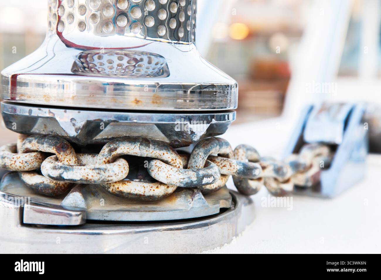 Anchor chain on a bollard of a motor yacht, close-up. Stock Photo