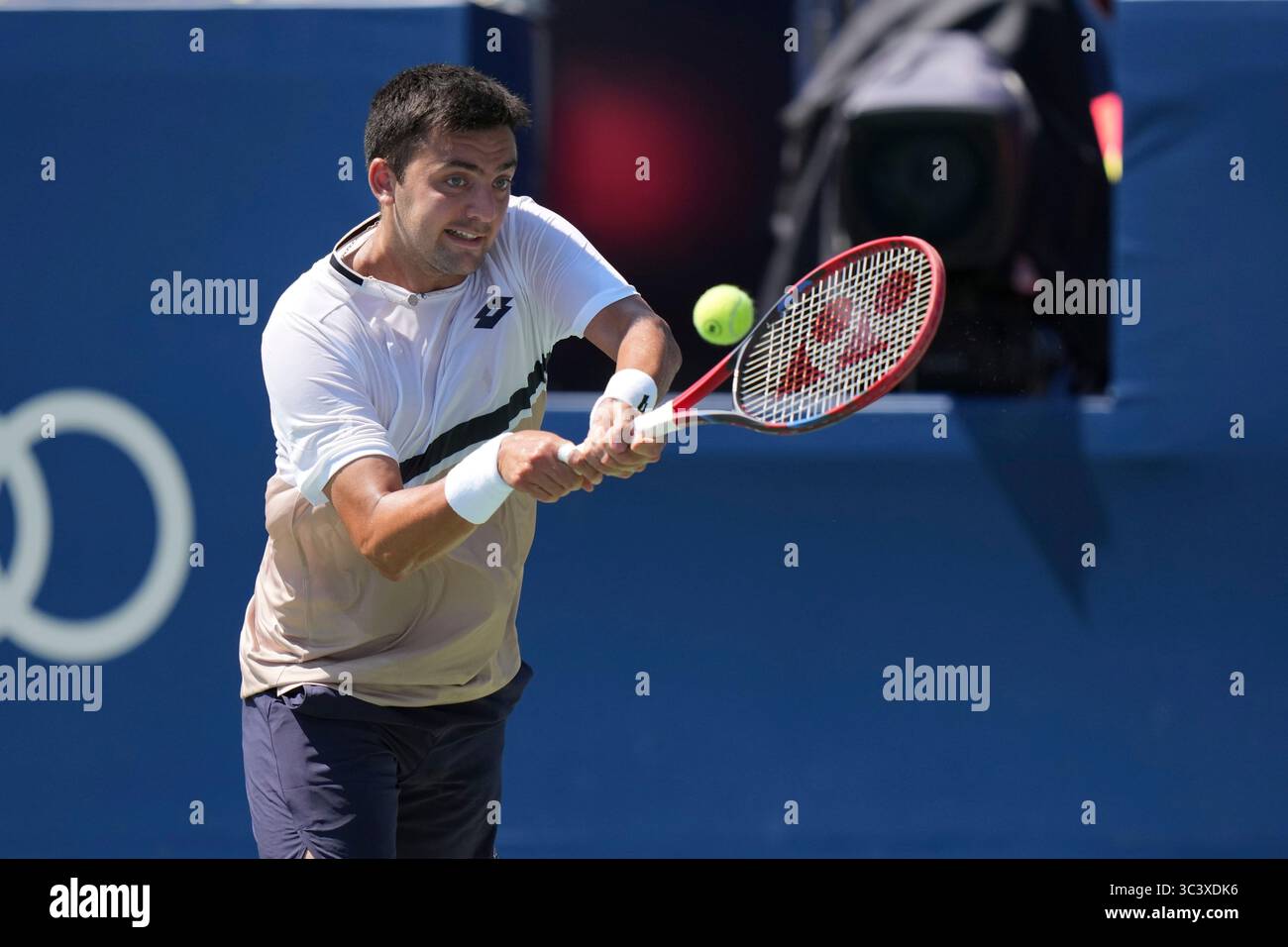 Toronto, Canada. 27th July, 2025. Tomas Barrios Vera of Chile plays a backhand against Gael Monfils of France during the Men's Singles first round match on day 2 of the ATP Masters 1000 National Bank Open at Sobeys Stadium. on July 27, 2025 in Toronto, Canada. (Photo by Leonardo Ramirez/ Eyepix Group/Sipa USA) Credit: Sipa USA/Alamy Live News Stock Photo