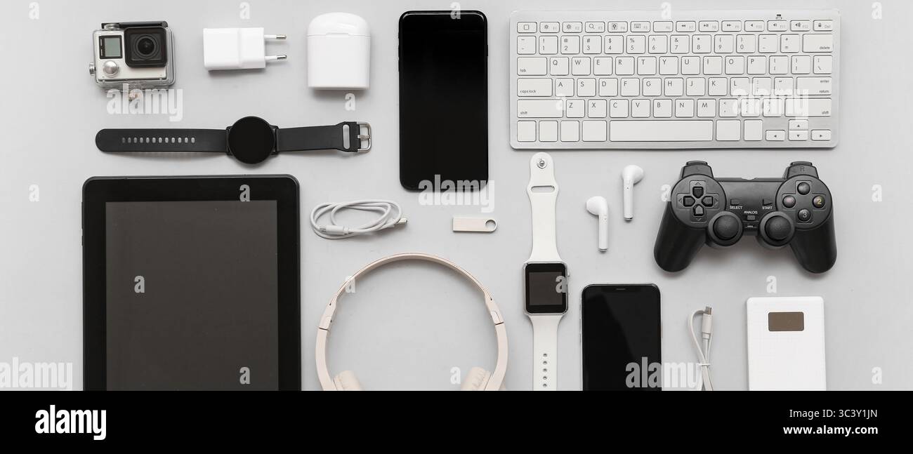 Many different modern gadgets on grey background Stock Photo