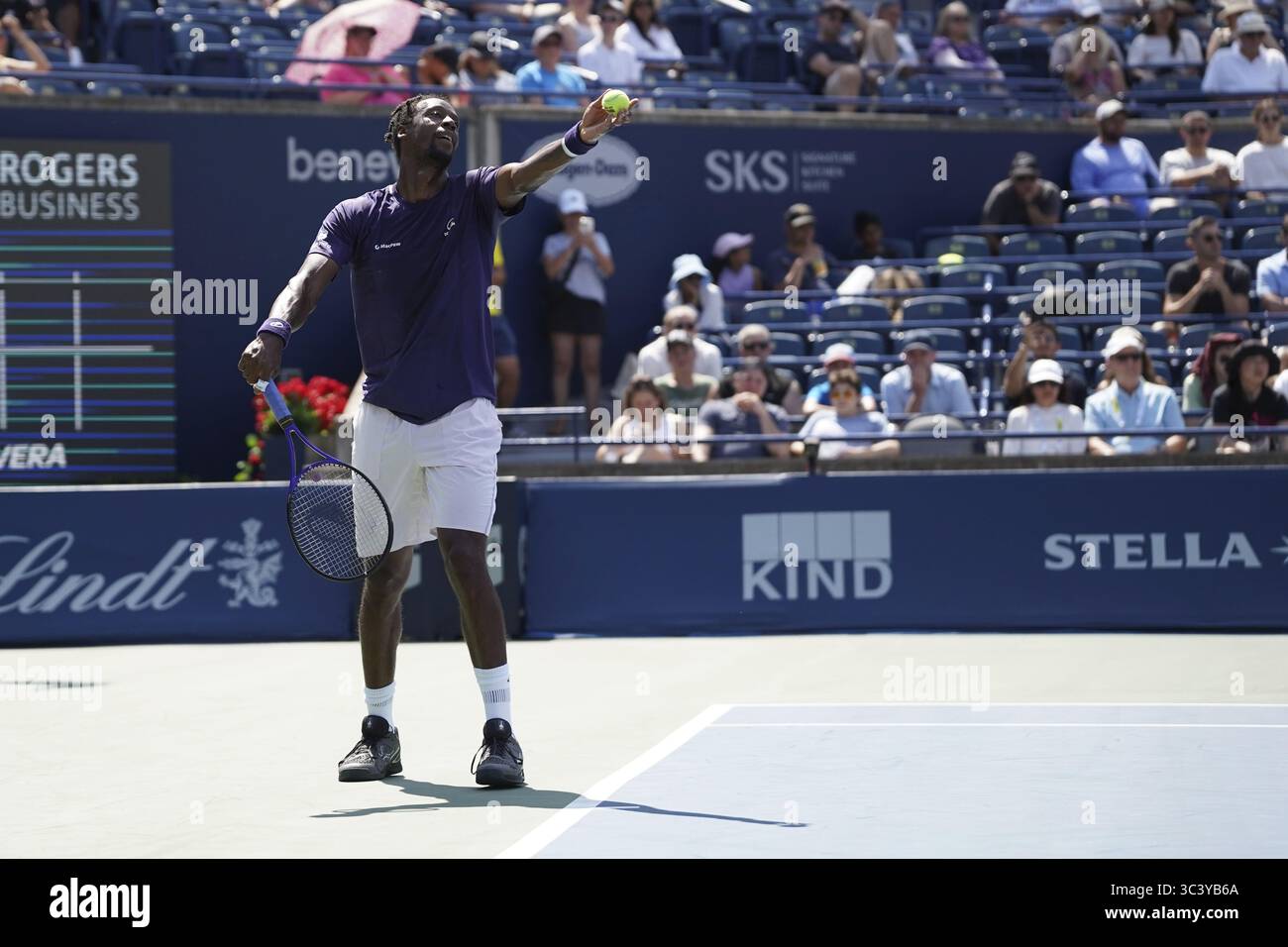 Non Exclusive: Gael Monfils of France serves to Tomas Barrios Vera of Chile (not pictured)  during the Men's Singles first round match on day 2 of the Stock Photo