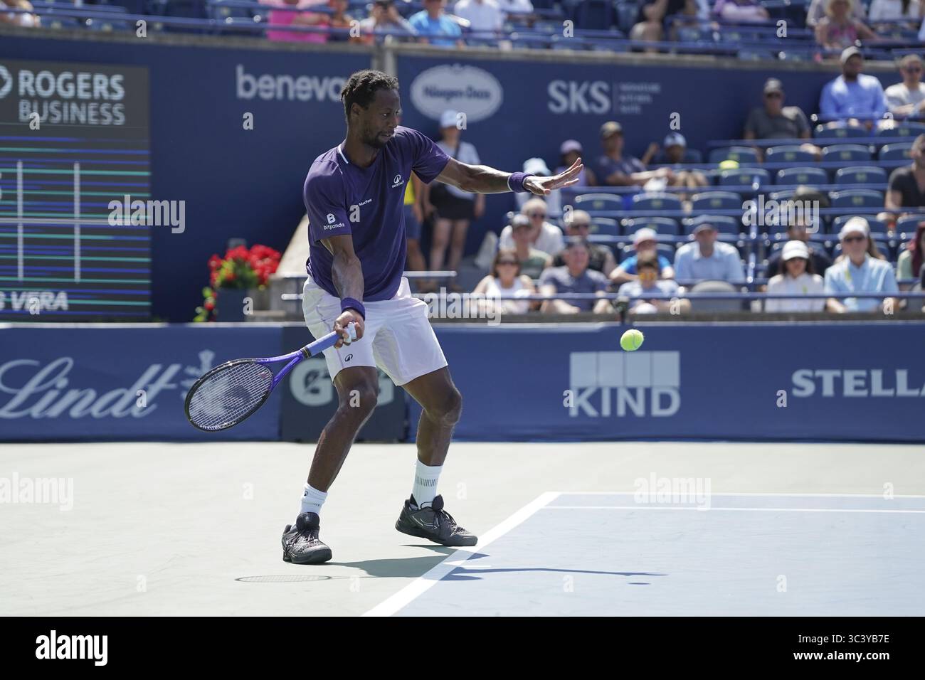 Non Exclusive: Gael Monfils of France plays a forehand against Tomas Barrios Vera of Chile during the Men's Singles first round match on day 2 of the Stock Photo