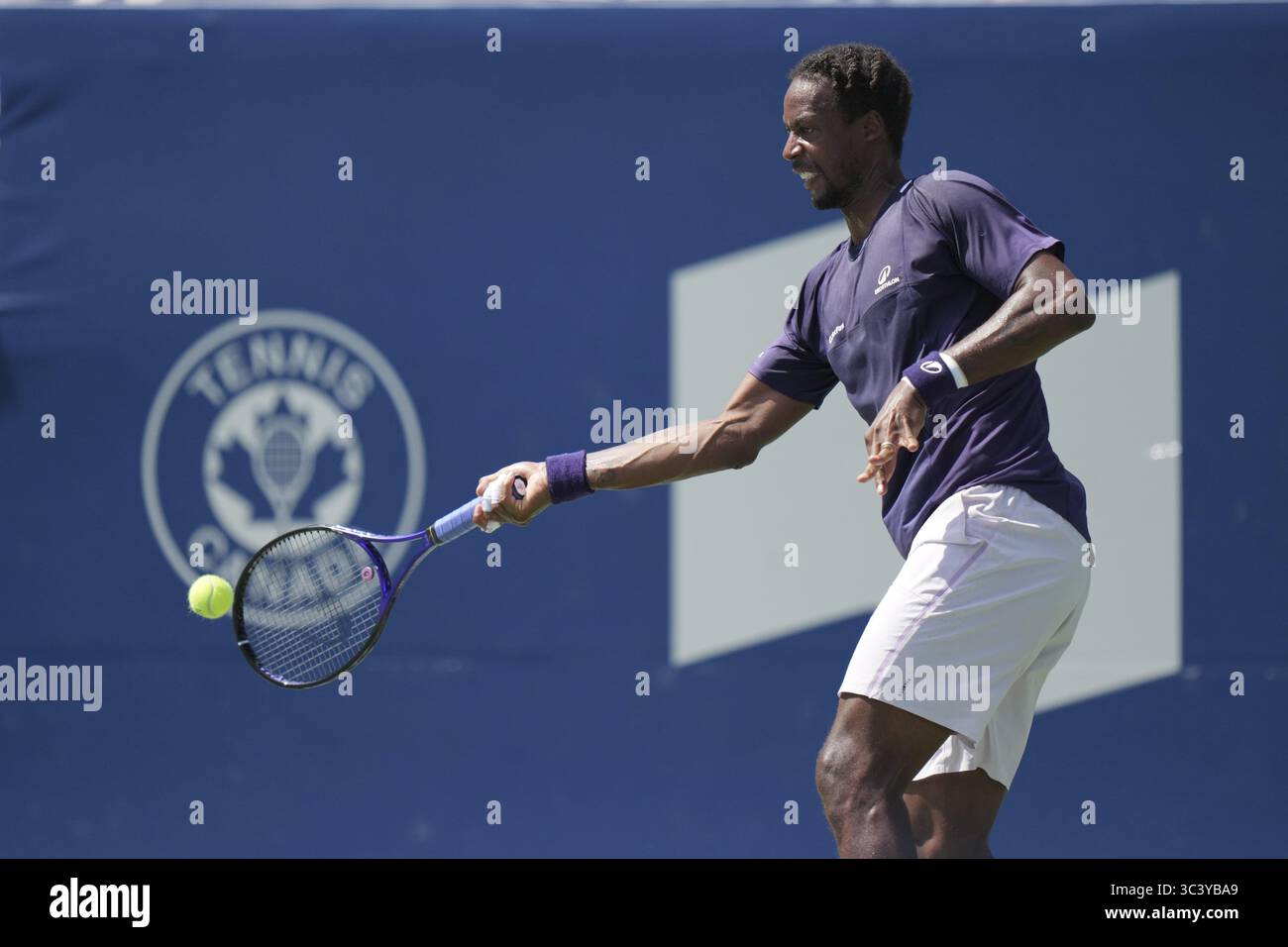 Non Exclusive: Gael Monfils of France plays a forehand against Tomas Barrios Vera of Chile during the Men's Singles first round match on day 2 of the Stock Photo