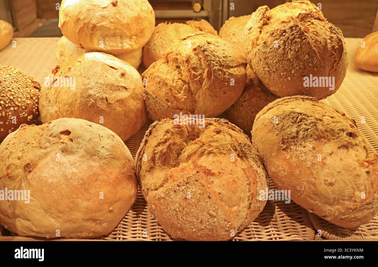 Freshly baked assorted breads in the bakery Stock Photo