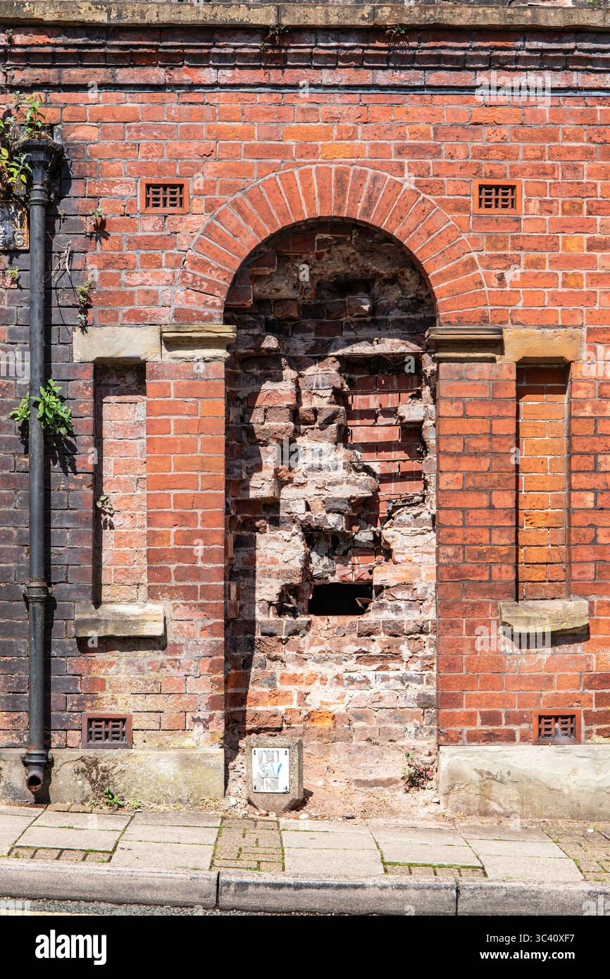 Open arch shape entrance showing internal wall of building Stock Photo