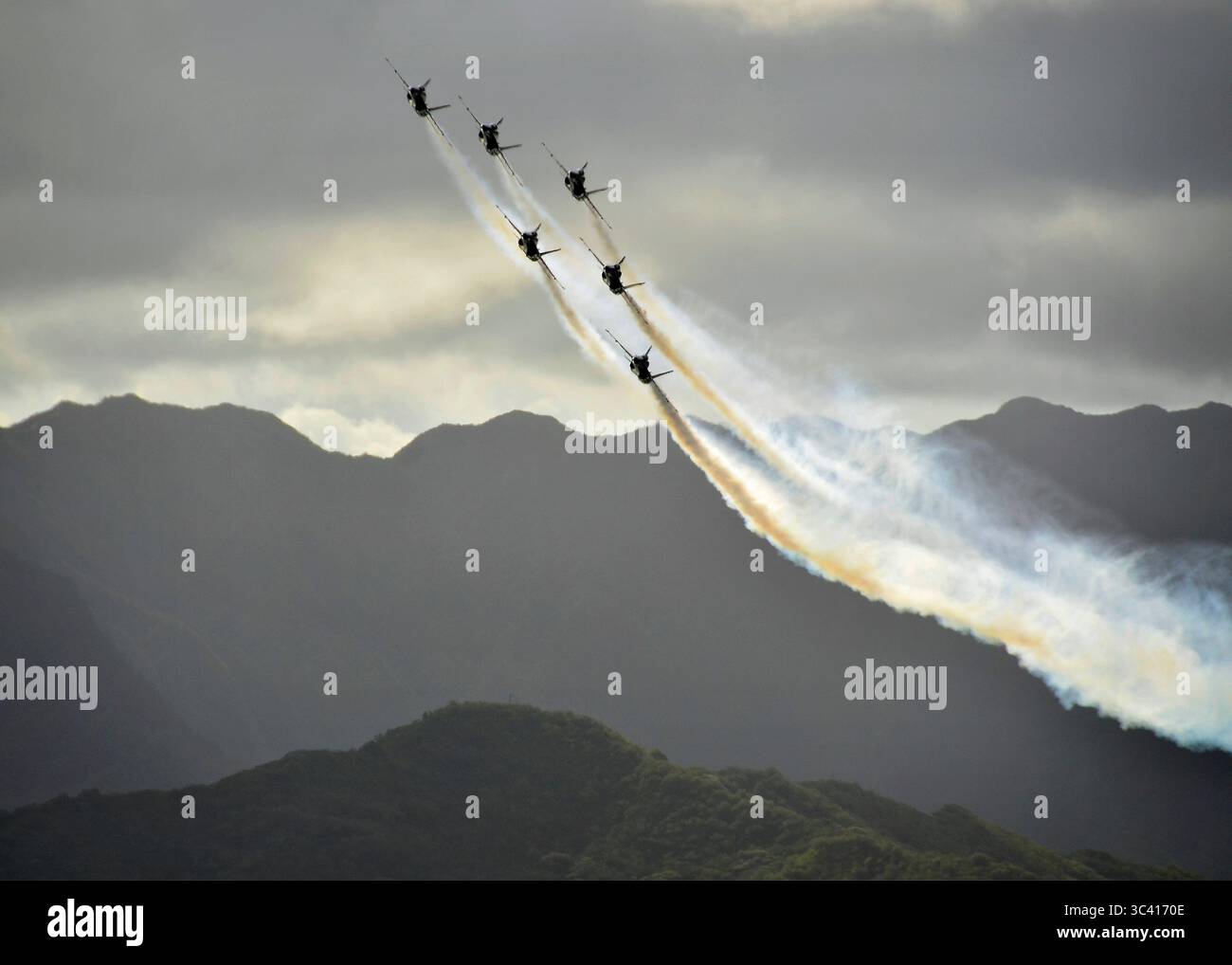 The U.S. Navy Flight Demonstration Squadron Blue Angels prepare to make an overhead pass as they perform in F/A-18 Hornet aircraft during the 2012 Kaneohe Bay air show at Marine Corps Base Hawaii, on Sept. 30, 2012.  (DoD photo by Petty Officer 2nd Class Daniel Barker, U.S. Navy.  (Released)) Stock Photo